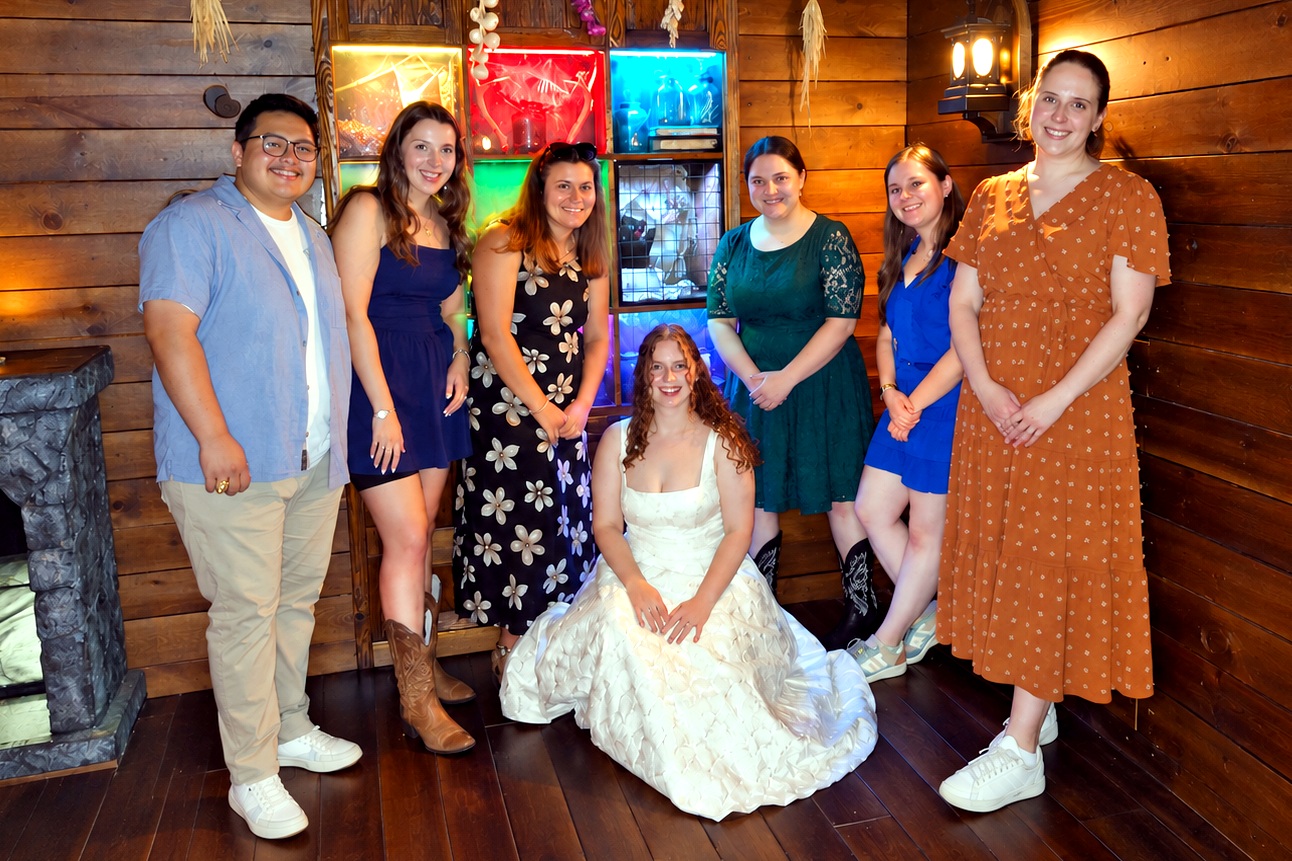 Bride and friends at an escape room bachelorette party inside Malediction