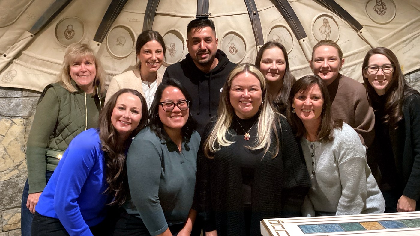 Corporate team inside Da Vinci's Challenge during an escape room team-building event